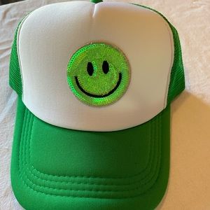 Green smiley face trucker hat